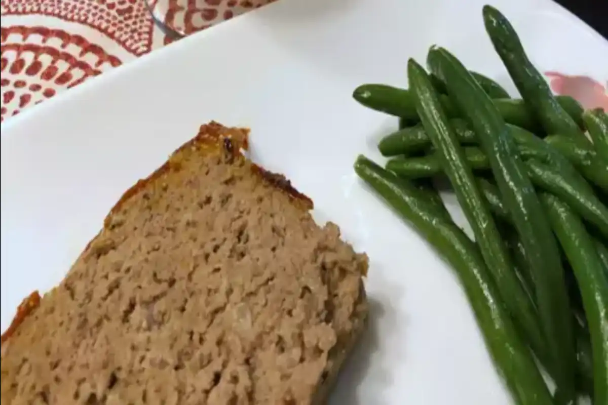A Cracker Barrel daily meatloaf on a white dish