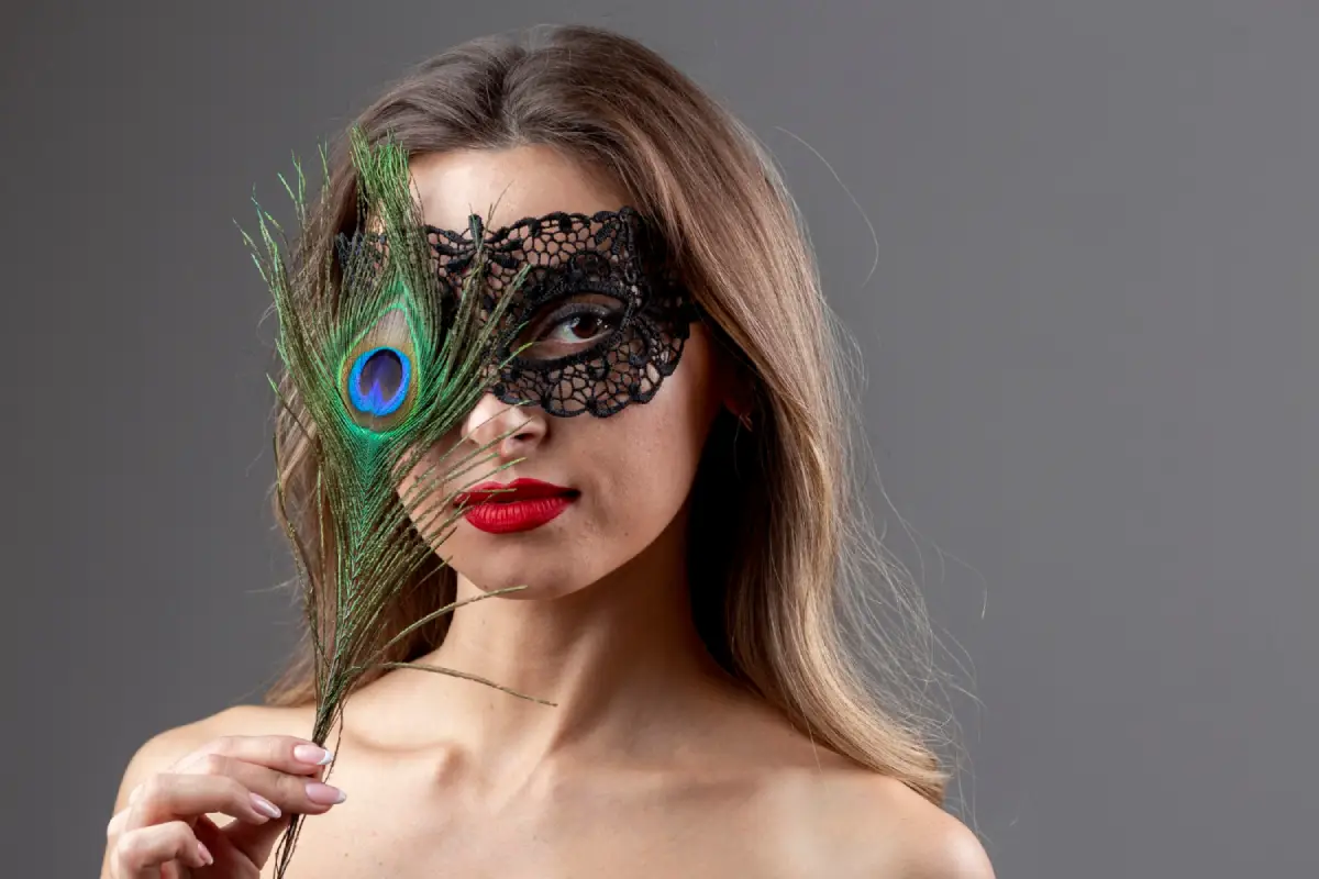 Woman with a peacock feather and lace mask, evoking themes of the opera Madame Butterfly