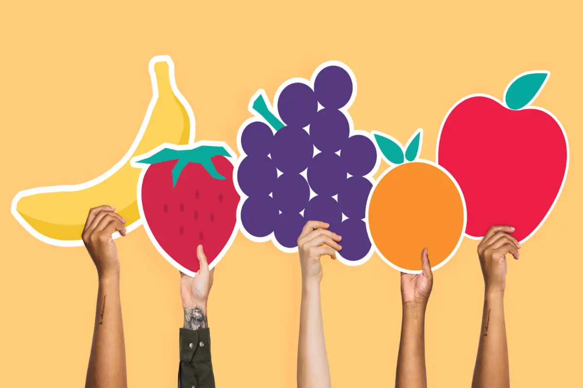 Hands holding colorful fruit clipart, representing diversity in product variations and innovations