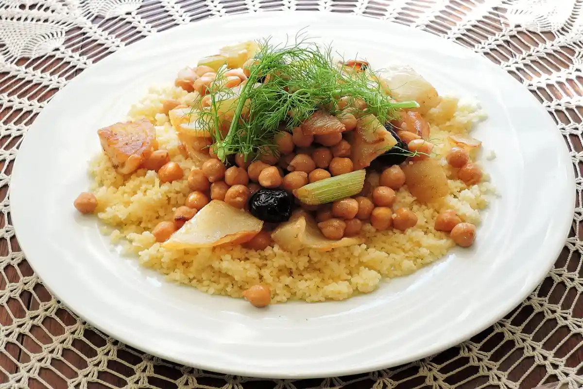 A wholesome plate of couscous with chickpeas and vegetables, highlighted as an alternative of pastina