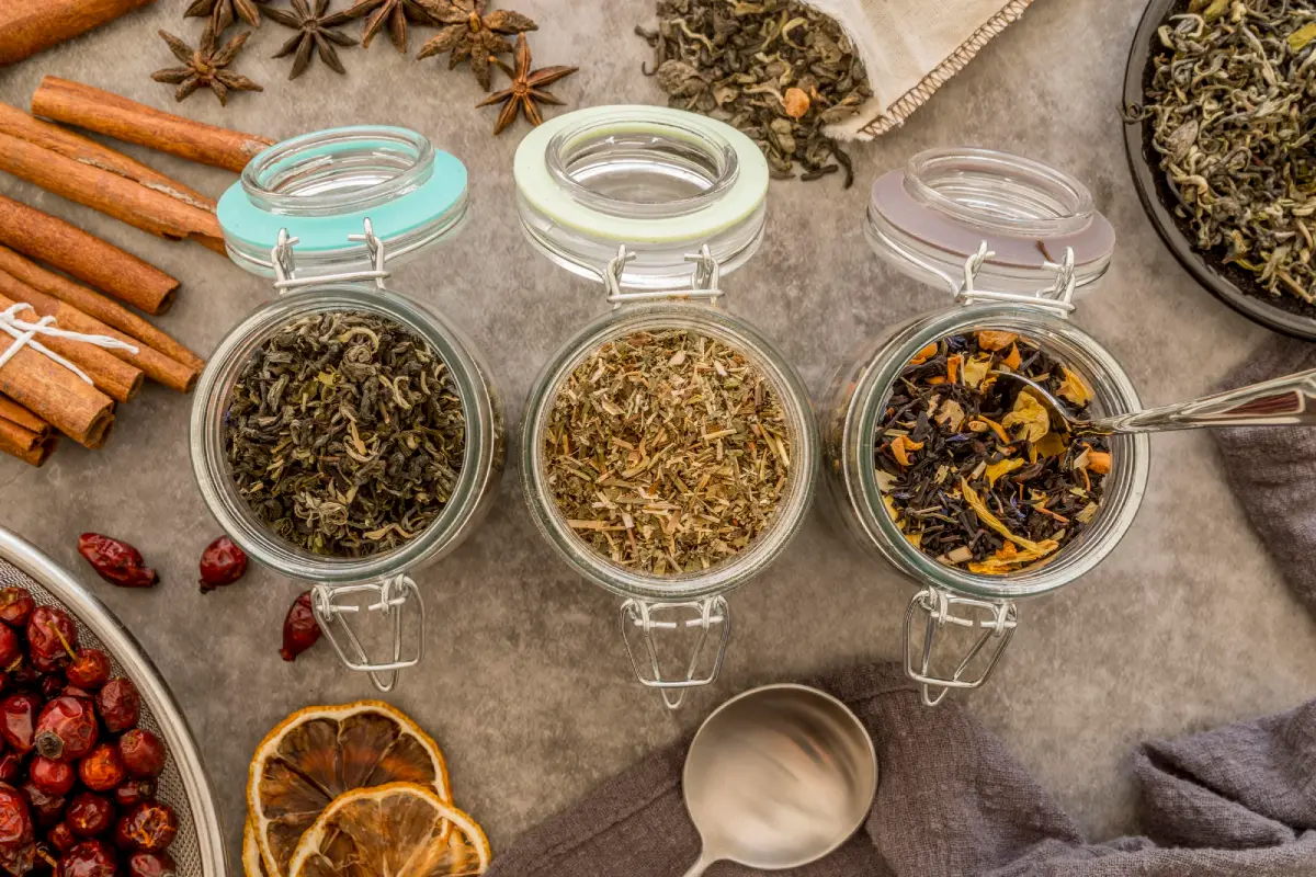 Assorted loose Earl Grey tea leaves in glass jars, showcasing the variety of blends.