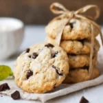 A rustic stack of cream cheese chocolate chip cookies tied with a twine bow