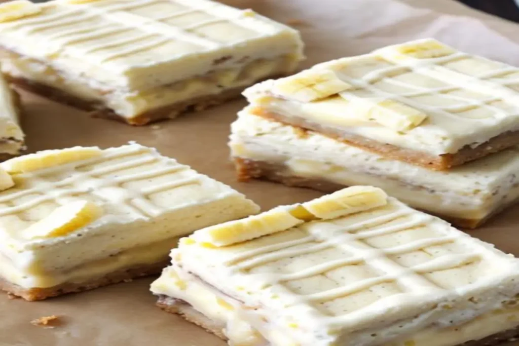 Decadent Banana Pudding Ice Cream Cookie Bars on a parchment-lined tray.